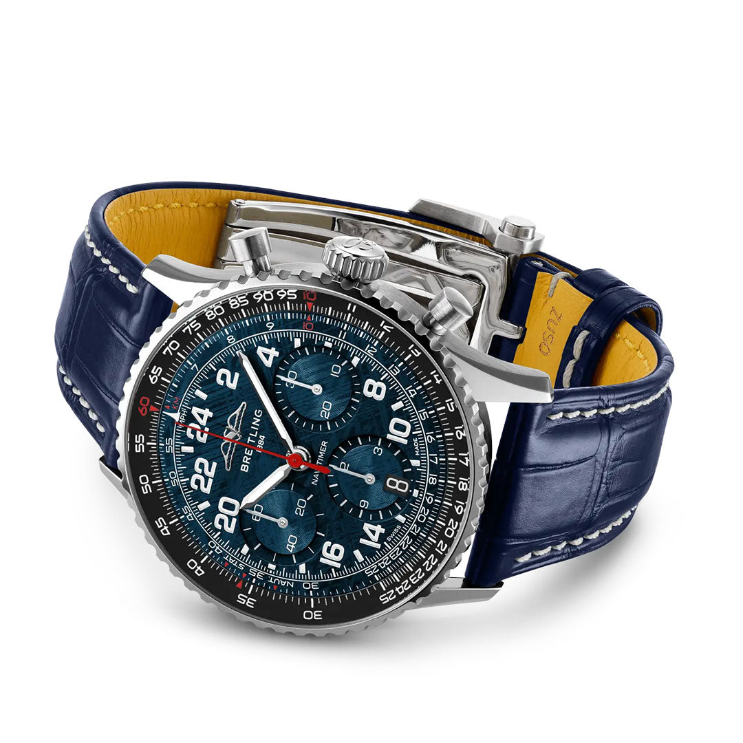 The BREITLING Navitimer B02 Chronograph 41 Cosmonaute Artemis II by Breitling features a blue leather strap, silver case, and detailed black dial with multiple subdials, white numerals, and red accents, shown on a white background.