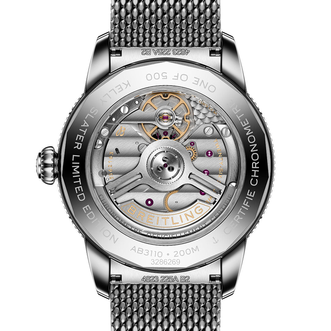 The image shows the back of a BREITLING Superocean Heritage B31 Automatic Kelly Slater 40, featuring a transparent case that reveals its mechanical movement and LIMITED EDITION engravings.