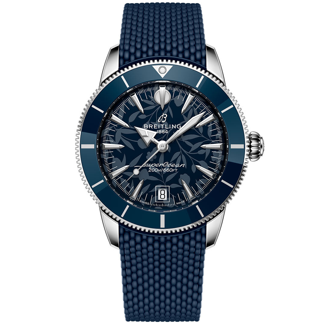 The BREITLING Superocean Heritage B31 Automatic Kelly Slater 40 features a blue textured rubber strap, stainless steel case, blue dial with luminous hands, date display, and 200m water resistance—reflecting classic surf culture.