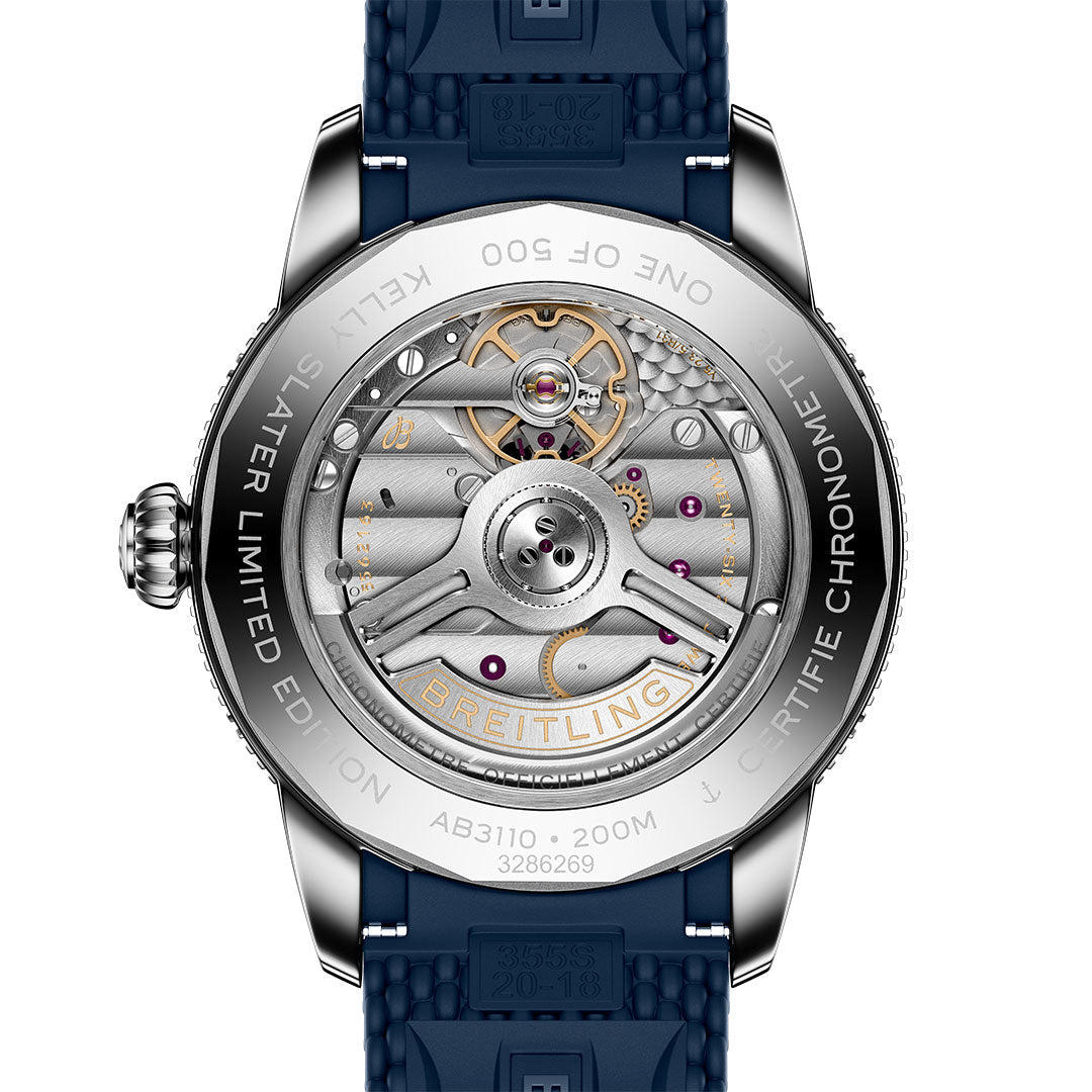 Close-up of the BREITLING Superocean Heritage B31 Automatic Kelly Slater 40's case back reveals its mechanical movement, engraved details, and blue rubber strap. The sapphire crystal back highlights this limited edition inspired by surf culture.