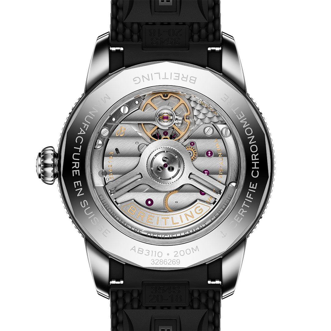 Close-up of the BREITLING Superocean Heritage B31 Automatic 40 by Breitling, showing its intricate mechanical movement through a transparent case back with visible gears, detailed engravings, and a black rubber strap.