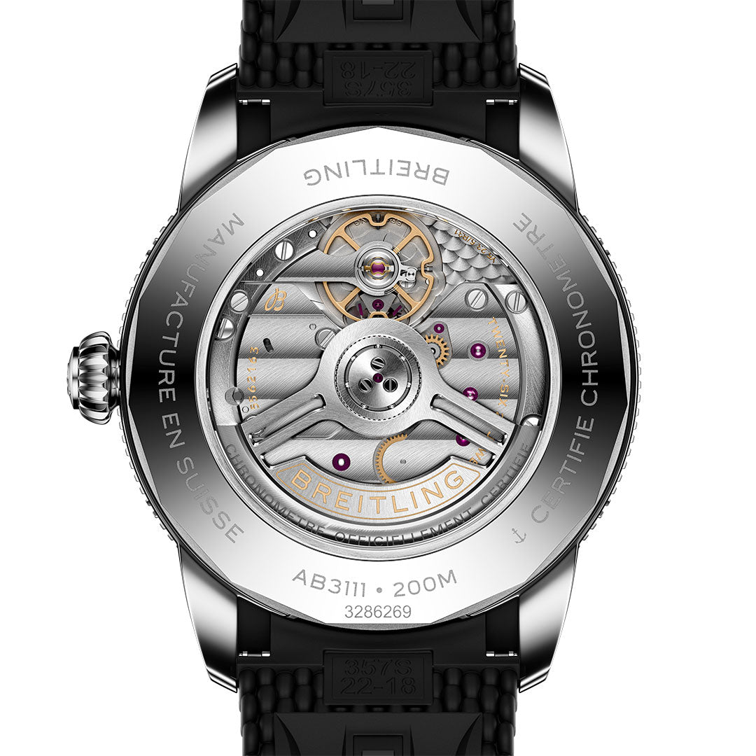 Close-up of the Breitling Superocean Heritage B31 Automatic 42's caseback, showing its exposed automatic movement, detailed metal gears, "BREITLING" engraving, water resistance (200M), and certification information.