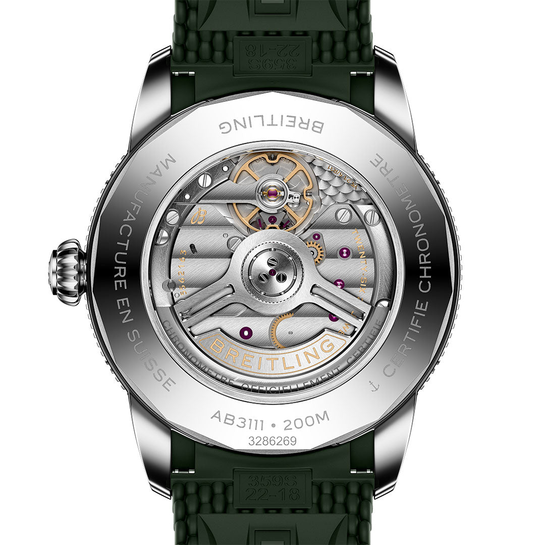 The Breitling Superocean Heritage B31 Automatic 42 has a transparent caseback displaying its mechanical movement, and the metal rim is engraved with "BREITLING," "MANUFACTURE EN SUISSE," "200M," plus a unique serial number.