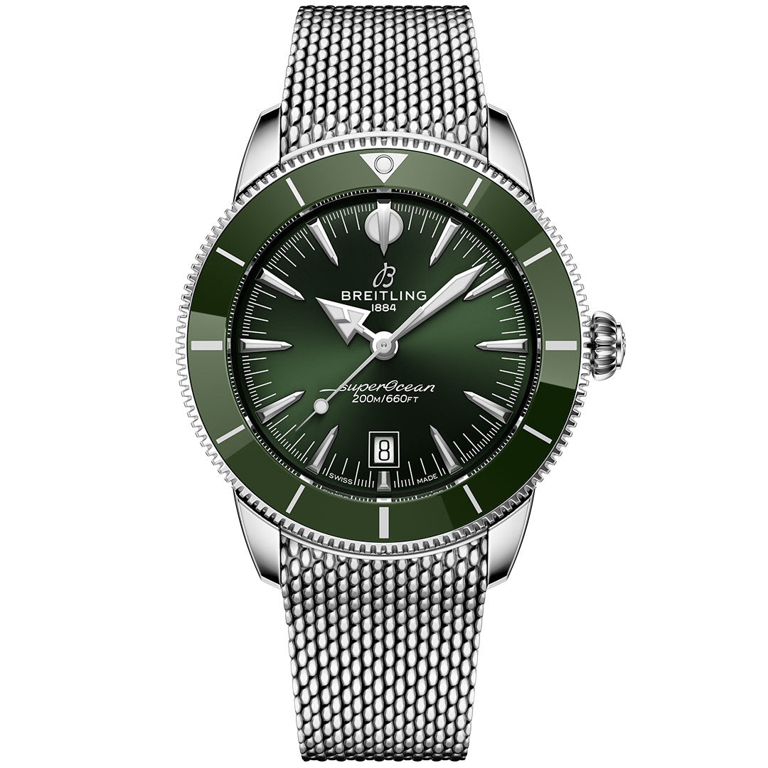The Breitling Superocean Heritage B31 Automatic 44 features a green bezel and dial, silver hour markers and hands, date at 6 o’clock, automatic movement, and a stainless steel mesh bracelet.