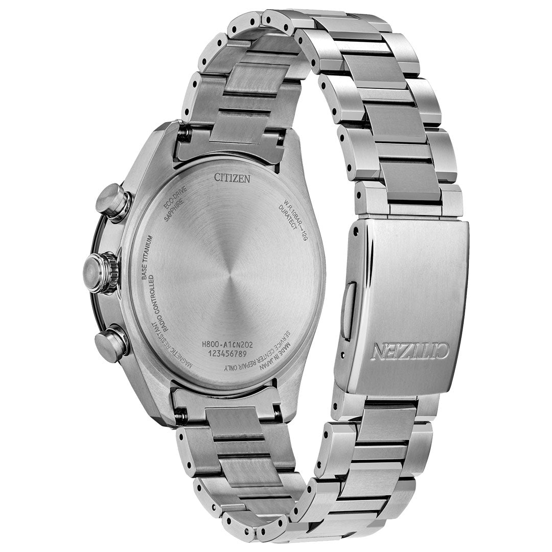 A close-up of the CITIZEN Attesa Atomic Time Keeping Super Titanium Limited Edition Eco-Drive 42mm Watch showcases the engraved case back details and branded closed clasp on its sleek bracelet.