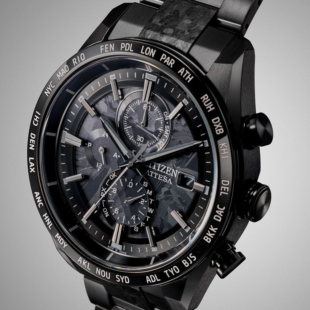 Close-up of the CITIZEN Attesa Hakuto-R Atomic Time Keeping Super Titanium Limited Edition Eco-Drive 42mm watch, featuring multiple dials, city abbreviations on the bezel, and a textured face showcasing its advanced craftsmanship.
