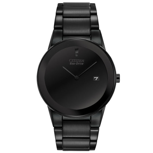 The CITIZEN Axiom Eco-Drive 40mm Watch, a sleek and minimalist timepiece in matte black ion-plated finish, features edge-to-edge glass. Its watch face elegantly displays two slim hands and a small date window at the 3 o'clock position. The stainless steel band beautifully complements the overall design.