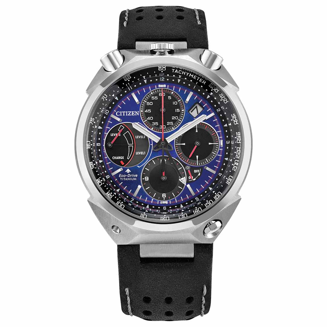 The CITIZEN Promaster Tsuno Chrono Racer E210 Eco-Drive 43.3mm Watch Limited Edition is a silver and black wristwatch with a blue and black dial, featuring multiple dials and silver hour markers. It displays "Eco-Drive Titanium" and comes with a perforated black leather strap.