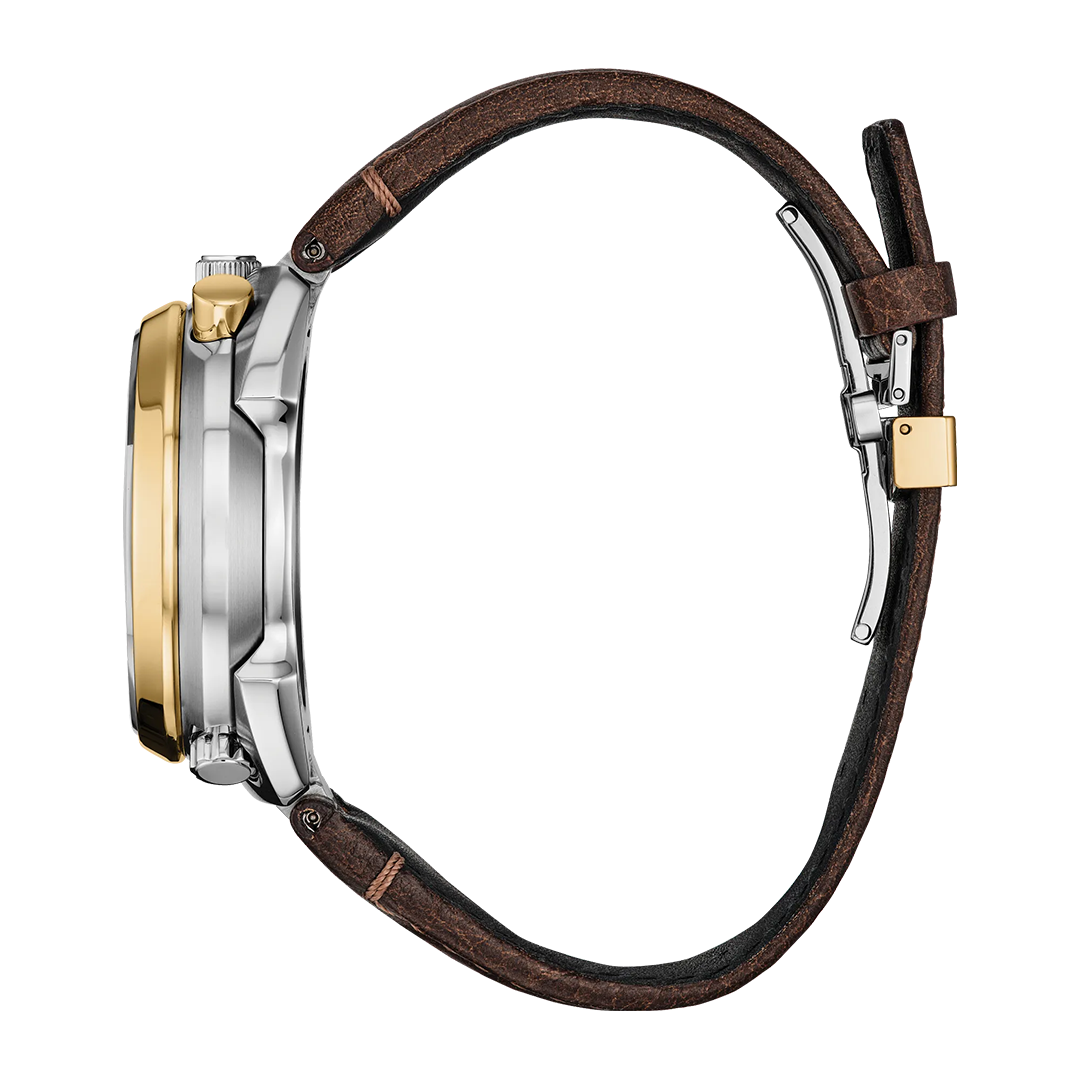 Side view of the CITIZEN Promaster Tsuno Chrono Racer Limited Edition Eco-Drive 44.5mm Watch, featuring a striking silver and gold case, brown leather strap, and metal buckle, displayed against a white background. This timepiece is inspired by CITIZEN’s iconic Promaster Tsuno Chrono series.