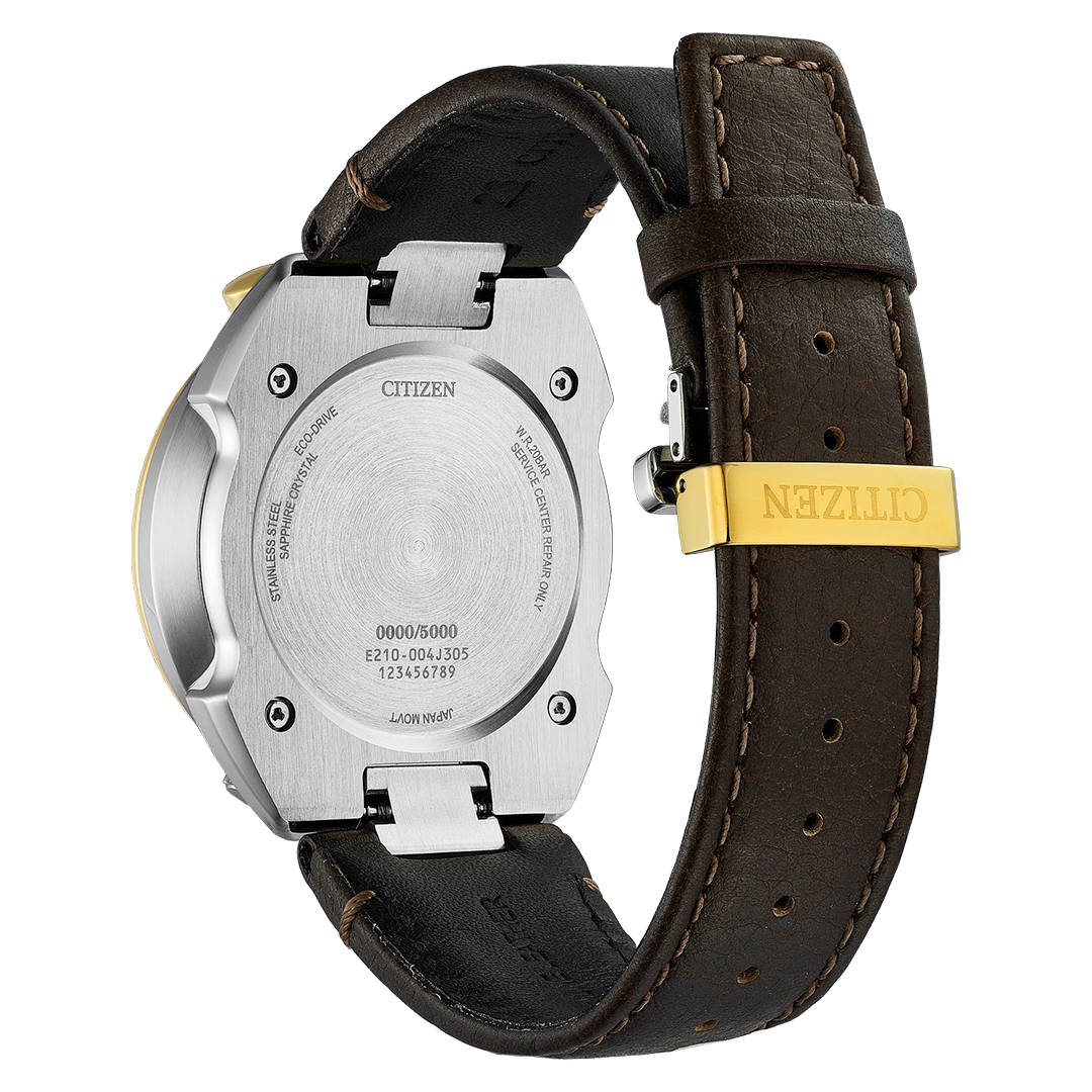 Close-up of the back of a CITIZEN Promaster Tsunoc Chrono Racer Limited Edition Eco-Drive 44.5mm Watch, featuring a brown leather strap and gold clasp. The brushed metal caseback displays engraved text including model and serial numbers. This limited edition watch from CITIZEN boasts Eco-Drive technology for reliable, battery-free performance.