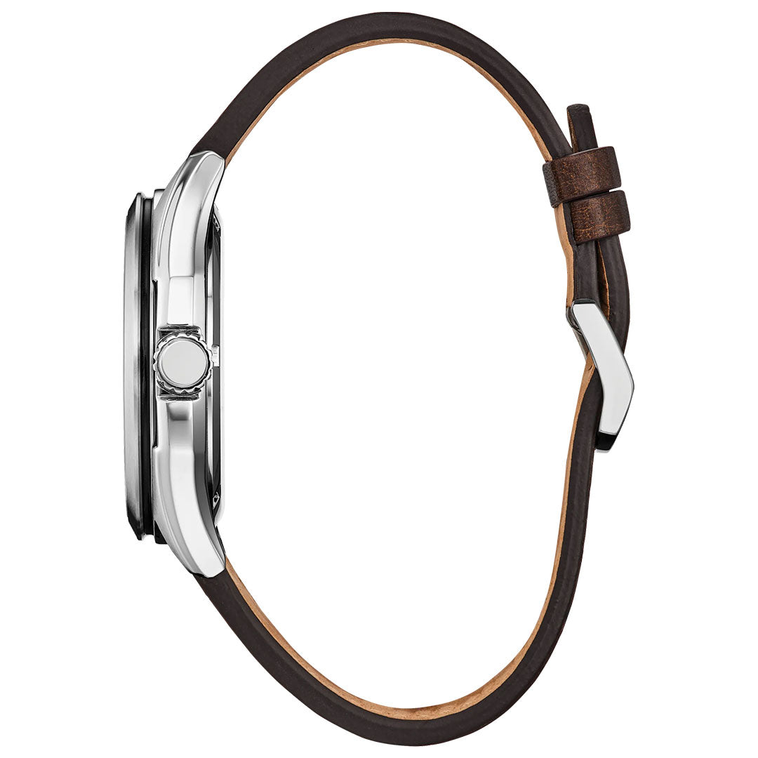Side view of the CITIZEN Terra Force Eco-Drive 41.2mm Watch by CITIZEN, featuring a round silver case, single side button, and brown leather strap with a silver buckle; watch face not visible.