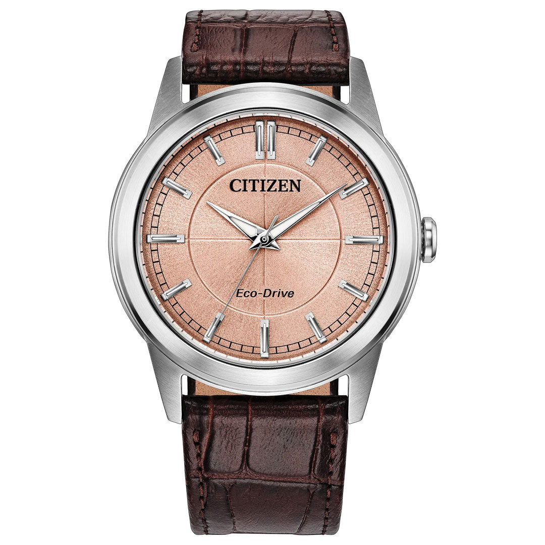 The CITIZEN Rolan Eco-Drive 41mm Watch by CITIZEN showcases advanced Eco-Drive technology, a light salmon dial with silver hour markers and hands, a stainless steel case, and a brown crocodile-pattern leather strap.