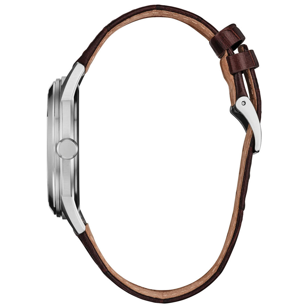 Side view of the CITIZEN Rolan Eco-Drive 41mm Watch, featuring a round silver stainless steel case and a brown leather strap from CITIZEN, highlighting the watch’s thickness and buckle detail.