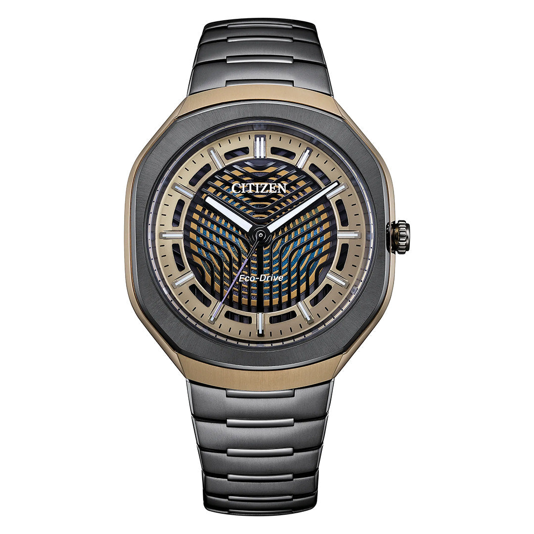 The CITIZEN Photon Eco-Drive 39.6mm Watch Limited Edition of 5,000 Pieces features a metallic band, a gold and black case, and a skeleton-style patterned dial with gold accents and geometric designs.