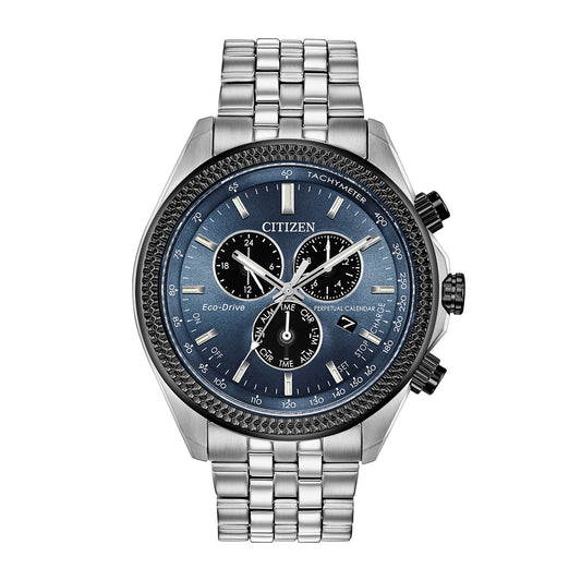 The CITIZEN Classic Eco-Drive 42mm Watch features a blue dial with three sub-dials, a tachymeter, and a perpetual calendar. It has a linked and polished stainless steel band that complements the sleek design of its round case.