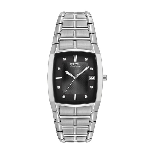 The CITIZEN Chandler Eco-Drive 30mm Watch boasts a rectangular black dial, stainless steel hour markers, and a date display at 3 o'clock. This sleek timepiece is complemented by a silver metal link band.