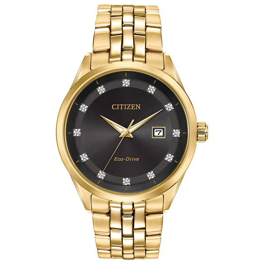 The CITIZEN Addysen Eco-Drive 41mm Watch features a black dial with diamond-like markers and a date display. Its Eco-Drive movement harnesses light for power, needing no batteries, while its elegant design is completed with a gold link bracelet.