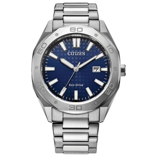 The CITIZEN Weekender Eco-Drive 41mm Watch features a blue textured dial complemented by white hour markers and hands, housed in a sophisticated stainless steel case. The date is positioned at three o'clock on the dial, while the bezel is adorned with engraved numbers. Its Eco-Drive technology guarantees accurate timekeeping and environmental sustainability.