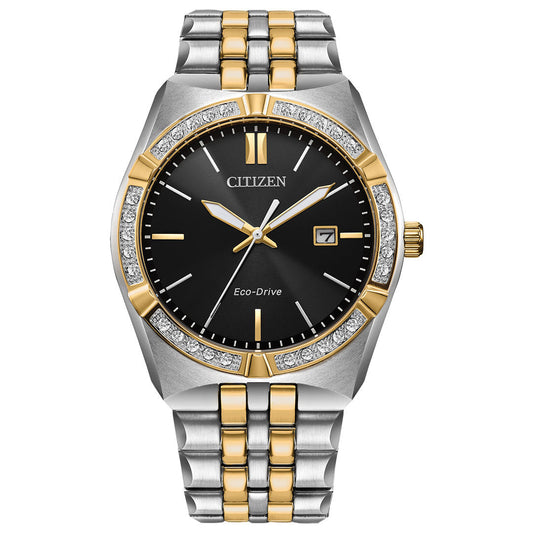 Introducing the CITIZEN Corso Diamond Eco-Drive 40mm Watch. This exquisite timepiece from CITIZEN features a striking black dial and a sophisticated two-tone design in gold and silver. It is equipped with a stainless steel bracelet, gold-toned indices, and a date display at the 3 o'clock position. The watch is further enhanced by a dazzling diamond-set bezel for an extra touch of elegance.