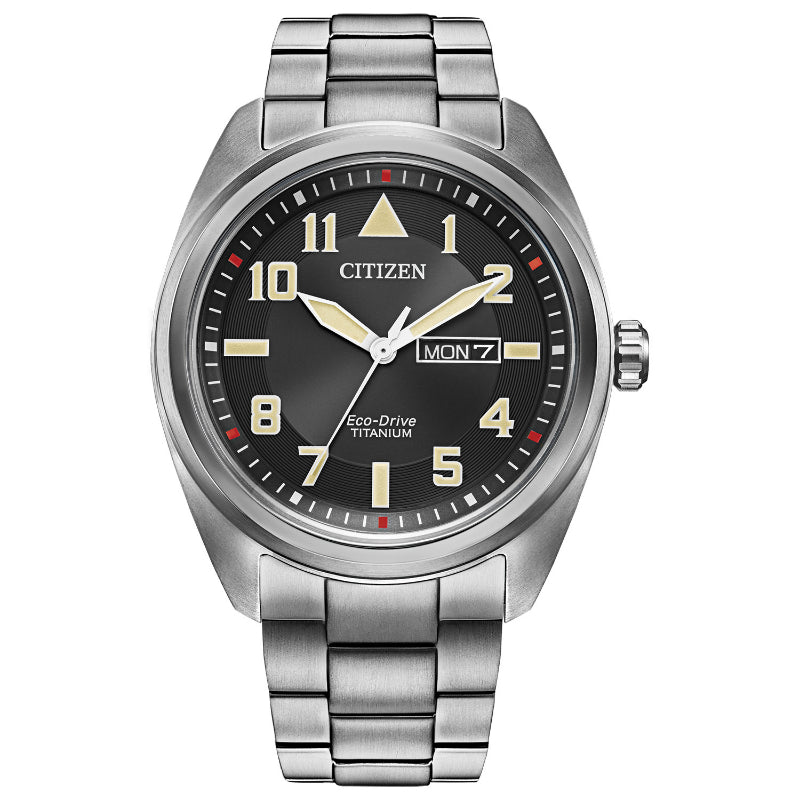 Explore the CITIZEN Garrison Titanium Eco-Drive 42mm Watch, showcasing a refined black dial. This distinguished timepiece is an ideal addition to any watch collection, featuring prominent luminous Arabic numerals, a side day-date window, and a sturdy metal bracelet. The luminous hands are accented with a subtle red touch on the second hand.