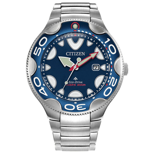 This CITIZEN Promaster Dive Eco-Drive 46mm Watch in silver features a blue face with luminous hour markers and hands. It includes a date display at the 3 o'clock position and a distinctive red seconds hand. As an ISO-compliant dive watch, it offers water resistance up to 200 meters.