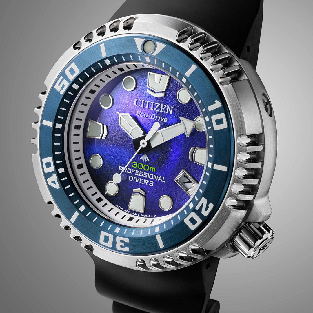 A close-up of the CITIZEN Promaster Dive Eco-Drive 46mm Watch Limited Edition, featuring a blue bezel, luminous markers and hands, “300m” water resistance, a black strap, and a rugged stainless steel case.