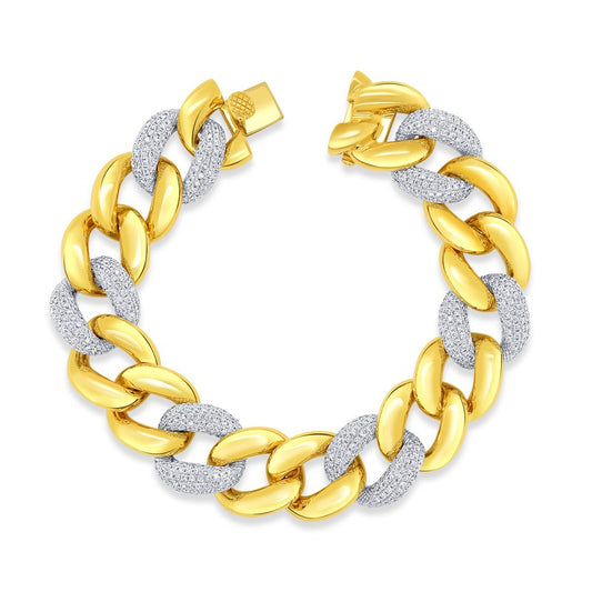 The Uneek 18K White Gold Diamond Bracelet from Uneek is crafted from 18 karat white gold and silver, featuring interlocking links with alternating polished gold and textured silver. Its clasp is elegantly designed in gold, creating a graceful circular shape as shown in the image.