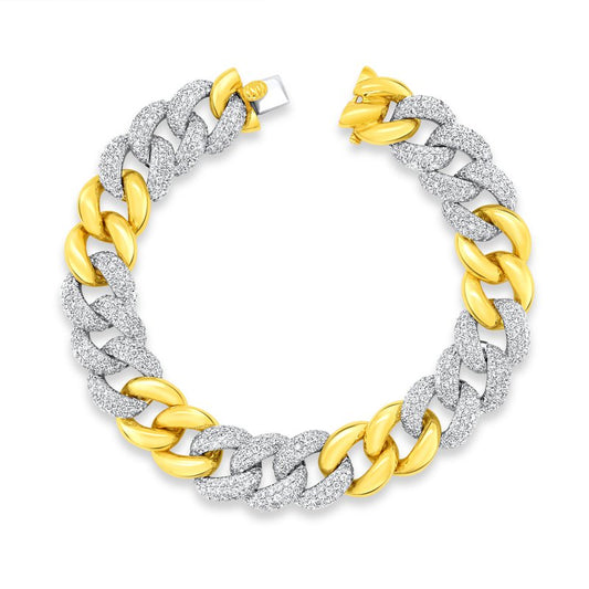 A close-up image showcases the Uneek Legacy Bracelet, a bold and modern 18K chain design forming a perfect circle. This exquisite piece features alternating links of textured white and polished yellow gold, creating a striking two-tone pattern with a secure clasp.