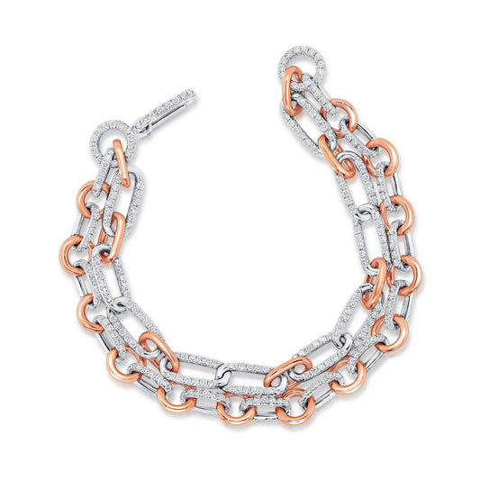 The Uneek Legacy bracelet, from the renowned brand Uneek, is a luxurious piece crafted from 18 karat white and rose gold links. It features an intricate and sophisticated design elegantly encrusted with sparkling diamonds.