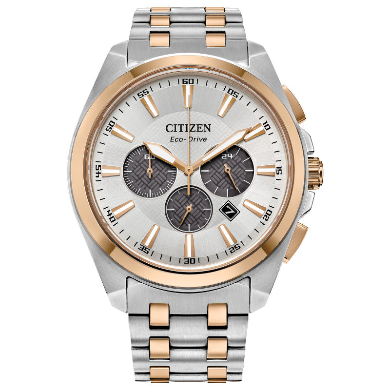 Introducing the CITIZEN Peyten Eco-Drive 41mm Watch, a remarkable timepiece featuring a sophisticated silver and gold stainless steel band. It boasts a scratch-resistant sapphire crystal encasing a round face with three subdials, a date feature, and elegant gold-tone accents. The watch also includes luminous hands and offers water resistance for enhanced durability.