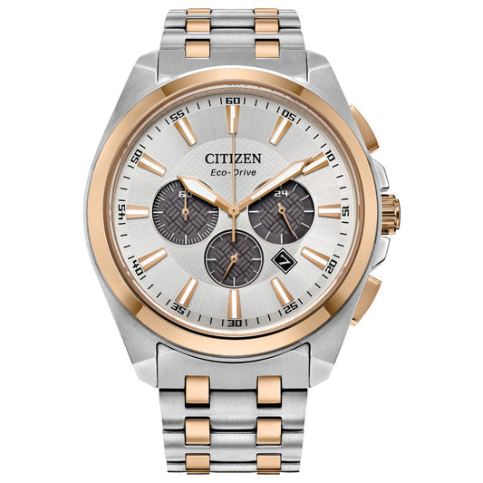 Introducing the CITIZEN Peyten Eco-Drive 41mm Watch, a remarkable timepiece featuring a sophisticated silver and gold stainless steel band. It boasts a scratch-resistant sapphire crystal encasing a round face with three subdials, a date feature, and elegant gold-tone accents. The watch also includes luminous hands and offers water resistance for enhanced durability.