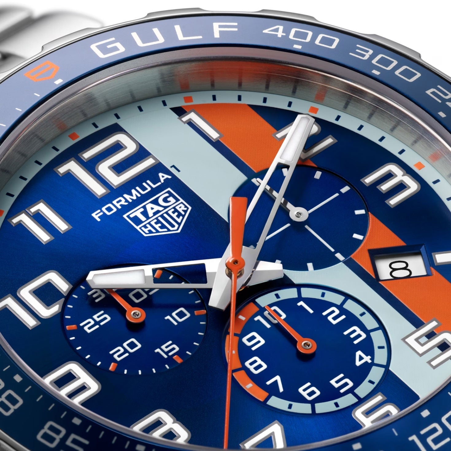 Close-up of the TAG Heuer Formula 1 Chronograph x Gulf Special Edition Quartz 43mm watch face by TAG Heuer, showcasing striking blue and orange motorsport-inspired accents, bold white numerals, three subdials, and a date window at 3 o’clock.