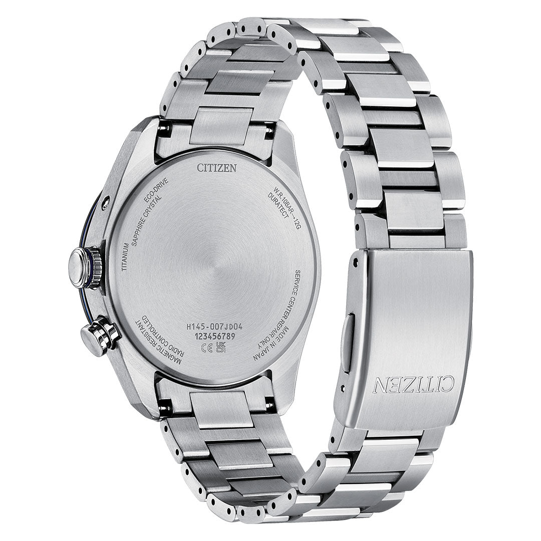 The image shows the back of a CITIZEN Attesa Hakuto-R Atomic Time Keeping Super Titanium Limited Edition Eco-Drive 40.6mm watch, featuring engraved branding and reference numbers on its silver Super Titanium case and clasp.