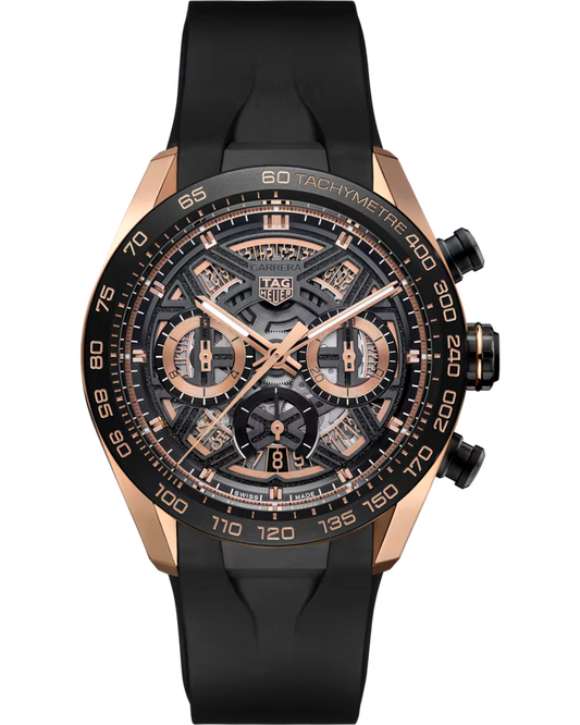 The TAG Heuer Carrera Chronograph Extreme Sport Automatic 44mm Watch features a luxurious black and rose gold skeleton dial with chronograph subdials, a tachymeter scale, and a black rubber strap.