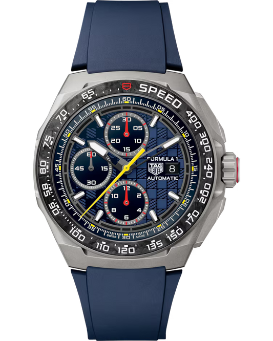 The TAG Heuer Formula 1 Chronograph x Oracle Red Bull Racing Special Edition Automatic 44mm watch features a silver case, blue rubber strap, stopwatch function, three blue subdials, a yellow second hand, and a checkered pattern on the dial. The bezel is marked with speed indicators.