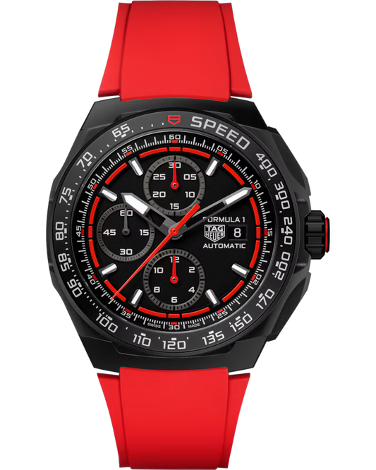 A TAG Heuer Formula 1 Chronograph Automatic 44mm watch by TAG Heuer featuring a black face, a red rubber strap, three subdials, a date window, and white markings on the bezel and dial.