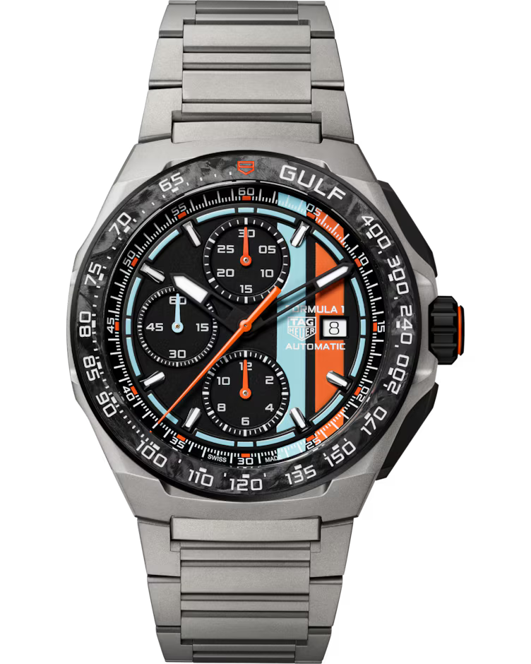 The TAG Heuer Formula 1 Chronograph x Gulf Special Edition Automatic 44mm Watch features a silver metal band, black bezel, and a distinctive light blue, orange, and black dial with three subdials and a date display.