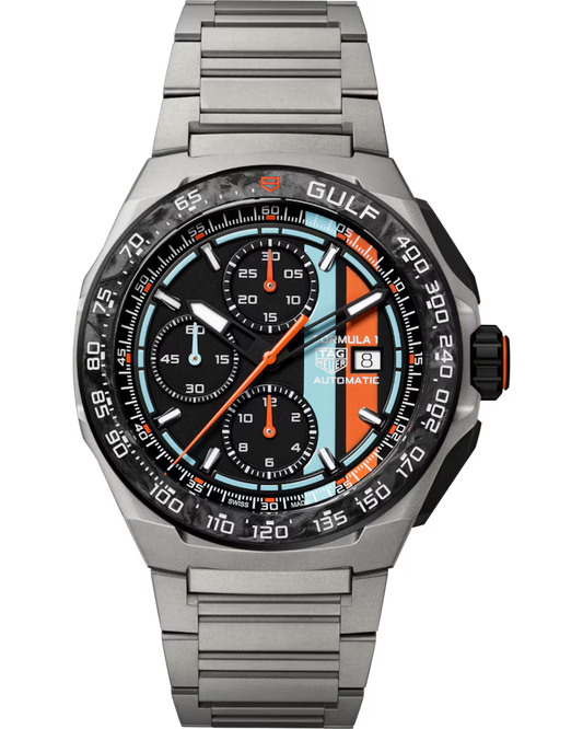 The TAG Heuer Formula 1 Chronograph x Gulf Special Edition Automatic 44mm Watch features a silver metal band, black bezel, and a distinctive light blue, orange, and black dial with three subdials and a date display.