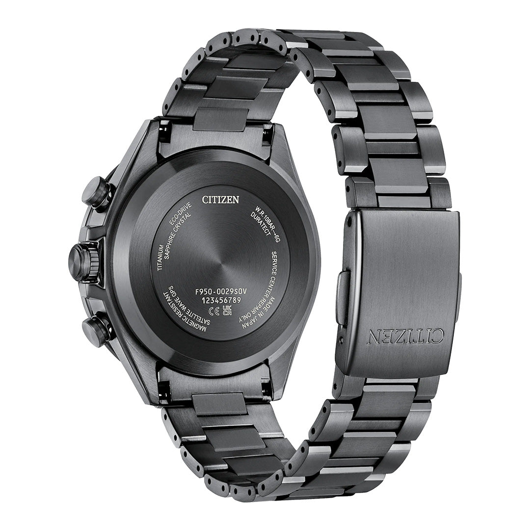 A close-up of the back of the CITIZEN Attesa Satellite Time Keeping Super Titanium Limited Edition Eco-Drive 44.6mm Watch, featuring a metallic black band and showcasing engraved details and the clasp with the CITIZEN logo. The watch is partially open, revealing the inner side and highlighting its advanced Eco-Drive Satellite Time Keeping technology.