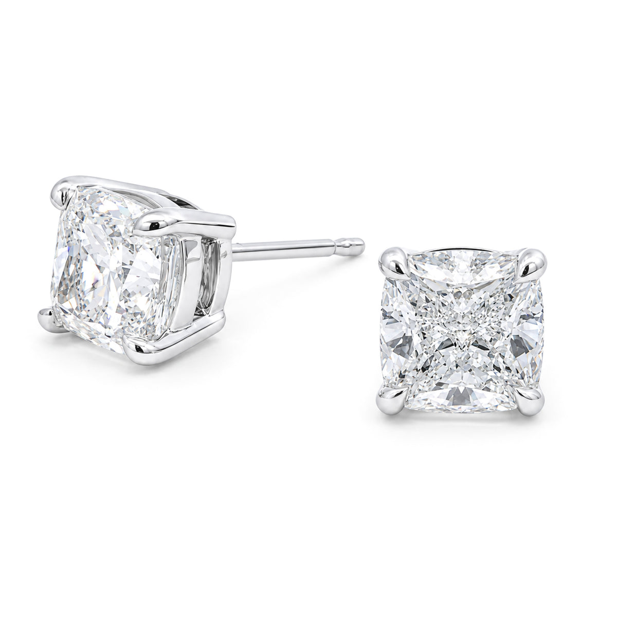 The Raffi&Co.® 14K White Gold Cushion Lab Diamond Stud Earrings feature a pair of VS1 clarity lab-grown diamonds set in elegant prong settings, beautifully displayed against a white background.