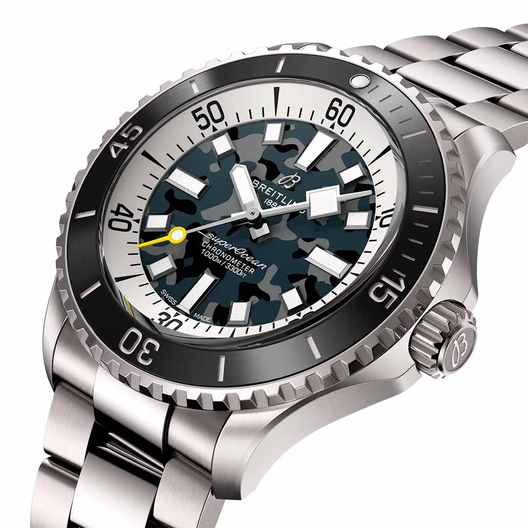 A detailed look at the Breitling Superocean Automatic 46 Super Diver showcases its stainless steel design tailored for diving, highlighted by a camouflage dial. It boasts prominent luminous hands, luminescent indexes, a yellow-tipped second hand, and a rotating bezel with minute markers. This luxury piece is completed with a sturdy link bracelet.