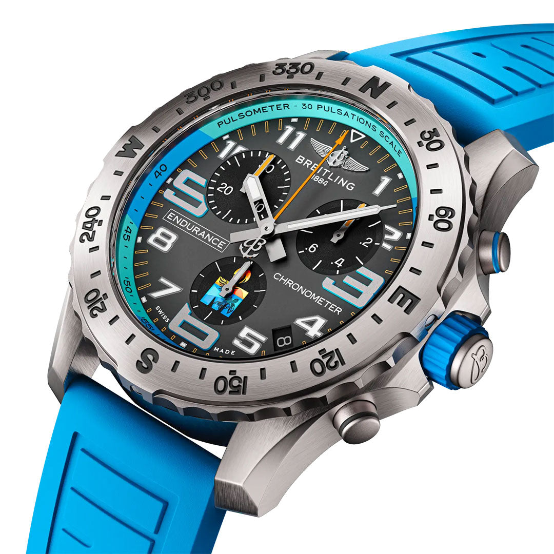 A close-up of the Breitling Professional Endurance Pro World Championship 2025 shows its sporty chronograph design with a blue rubber strap, silver bezel, black dial, turquoise accents, bold numerals, and multiple subdials.