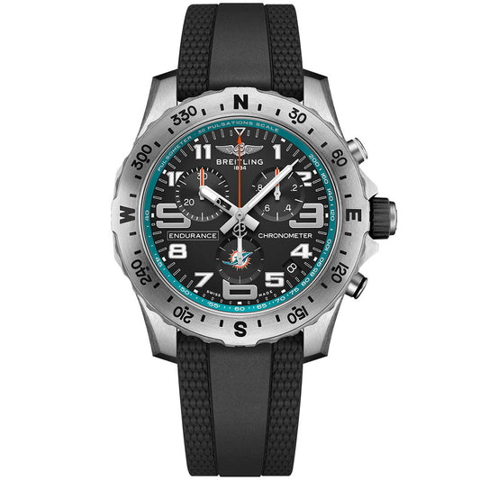 The Breitling Endurance Pro 44 NFL edition features a black rubber strap, black dial, silver bezel with black numerals, three subdials, white and turquoise accents, and bold white numerals at 12, 3, 6, and 9.