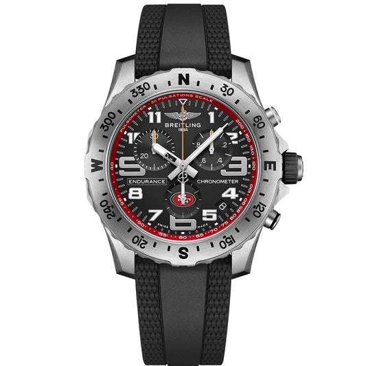 The Breitling Endurance Pro 44 features a black dial with red San Francisco 49ers-inspired accents, white markings, three subdials, a black rubber strap, and a silver bezel with a pulsometer scale.