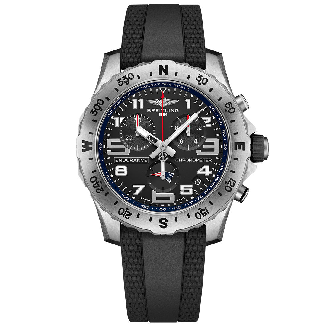 The BREITLING Endurance Pro 44 features a black dial with white numerals, three subdials, a pulsometer scale, black rubber strap, and a silver bezel with compass markings—ideal for New England Patriots fans.