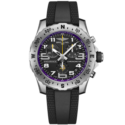 The BREITLING Endurance Pro 44 features a black strap, black dial with white numerals, luminous hands, purple accents like the Minnesota Vikings watch, a silver compass bezel, and multiple subdials.