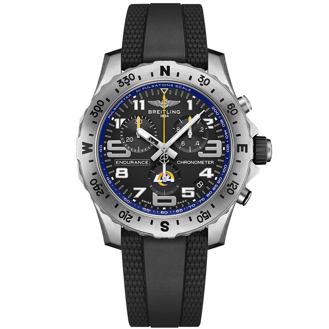 The BREITLING Endurance Pro 44, inspired by the Los Angeles Rams, showcases a black dial with white numerals, blue accents, a black rubber strap, and a silver bezel featuring a pulsometer scale.