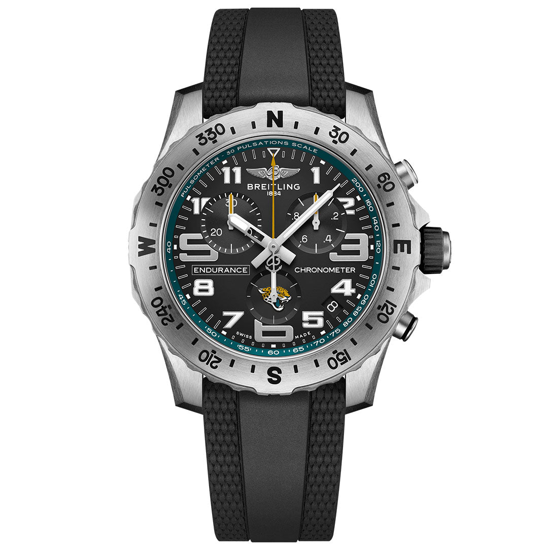 The BREITLING Endurance Pro 44 is a chronograph watch with a black dial, large luminescent numbers, multiple sub-dials, rotating bezel, black rubber strap, and pulsometer scale. Inspired by the Jacksonville Jaguars.