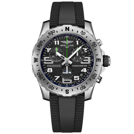 The BREITLING Endurance Pro 44 by Breitling features a black rubber strap, black dial with white markers, silver bezel with compass points, luminous hands, subdials, and date window—ideal for Seattle Seahawks watch fans.