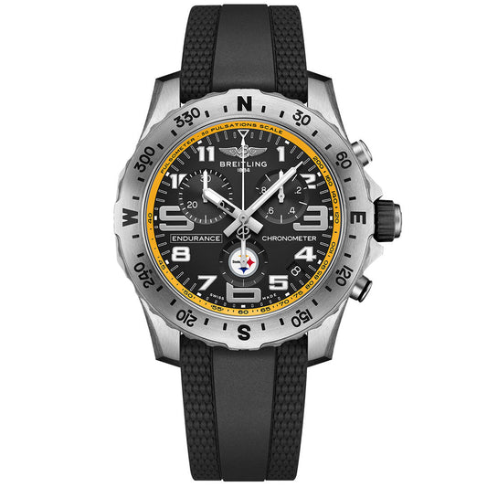The BREITLING Endurance Pro 44 is a sporty chronograph watch featuring a black dial with yellow accents, three subdials, bold white numerals, a textured black strap, and a silver compass bezel.